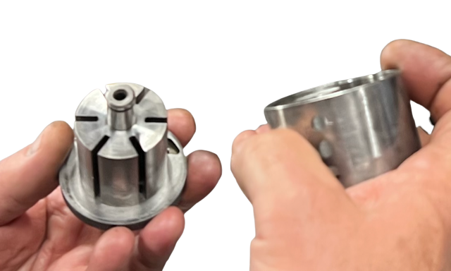 Hands holding freshly machined tool parts during a repair at Billow Co's Detroit shop
